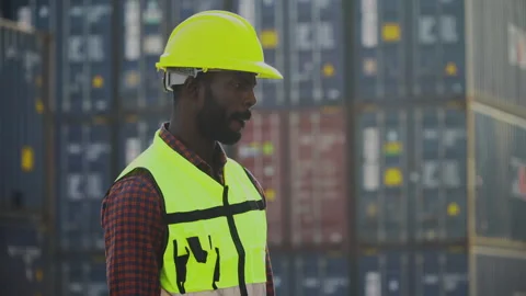 African american container worker confident and smiling standing at warehou.. Stock Footage 248348402