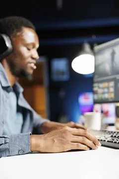 African american contractor creating motion picture clip project Stock Photos