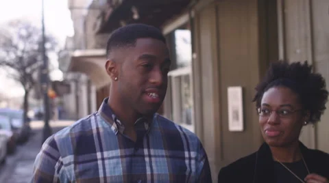 African American couple holding hands and walking Stock Footage