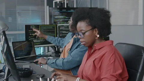 African American Couple of Programmers Talking at Workplace Stock Footage 276203431