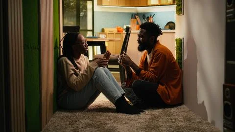 African American couple, solving problems, discussing in dark hallway Stock-Fotos