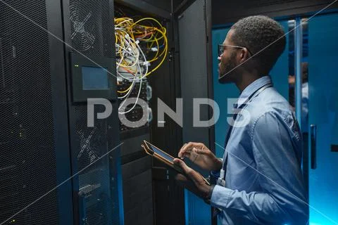 African American Data Engineer in Server Room Stock Image #148967021