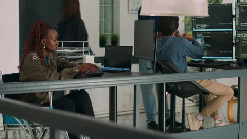 African american developer with disability working with programming language Stock Footage 221374601