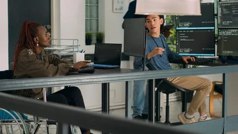 African american developer with disability working with programming language Stock-Fotos