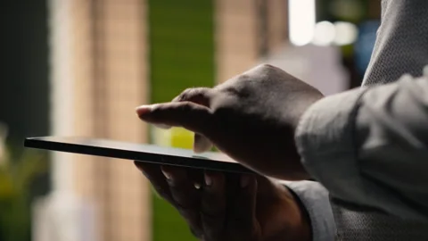 African american developer evaluating 3D models blueprints and digital software Stock Footage 316646314