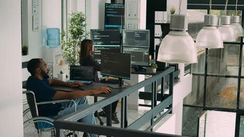 African american developer with impairment using computer to write code Stockfoto's