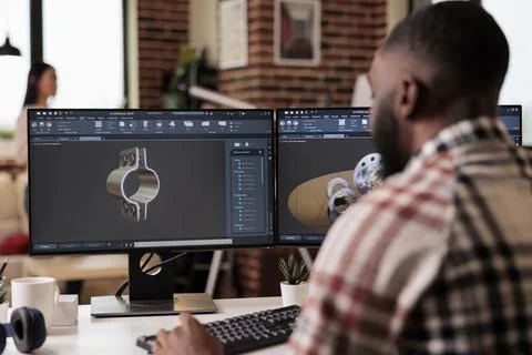 African american developer setting up gears model Stock Photos