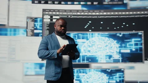 African American developer working on programming and automation Stock Footage 312359933