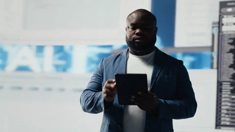 African American developer working on programming and automation Stock Footage 312477521