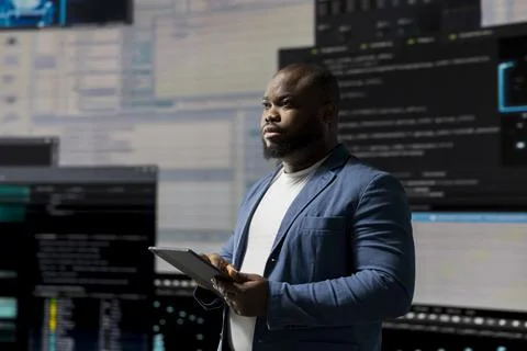 African American developer working on programming and automation Stockfoto's