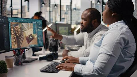 African american developers team using architectural software on computer Foto stock