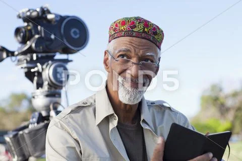 African American director near film camera Stock Photos