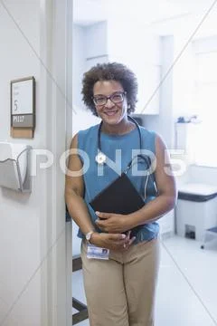 African American Doctor Holding Digital Tablet