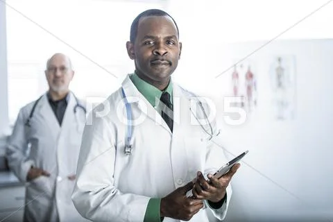African American Doctor Standing In Office