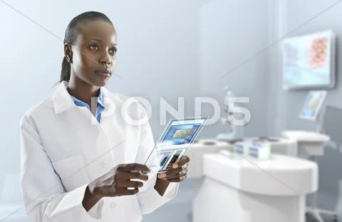 African American Doctor Using Digital Tablet In Laboratory