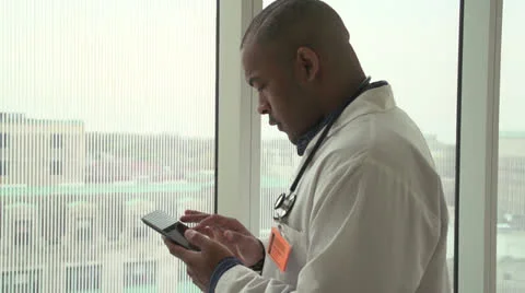 African American doctor using tablet 動画素材 24632036