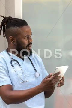 African American Doctor Using Tablet Computer