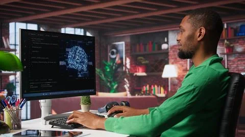 African american engineer coding a neural network AI brain model Stock Photos