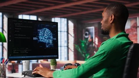 African american engineer coding a neural network AI brain model Stock Photos