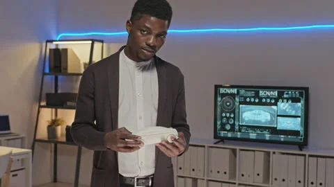 African-American Engineer Posing with Car Model Stock Footage 155246440