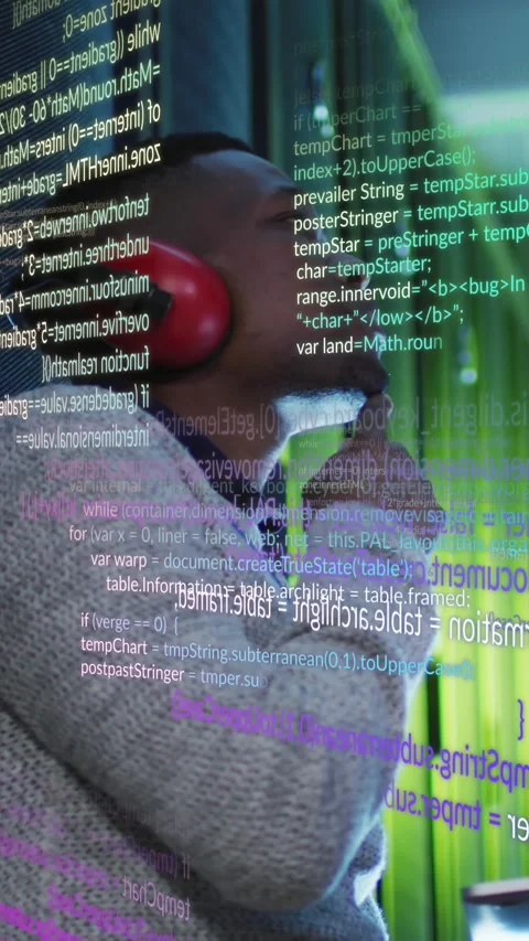 African American engineer processes data on laptop in server room, showcasing Stock Footage 343682591