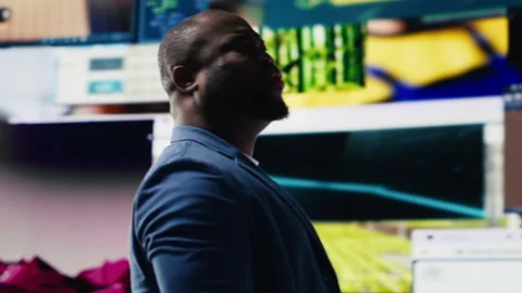 African american expert exploring tech driven environment with visual data Stock Footage 312359617