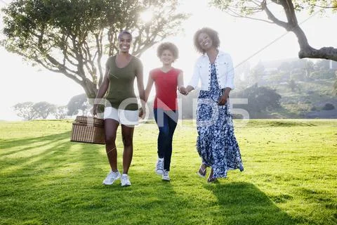 African American family walking in park Stock Photos