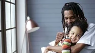 African American Father Embracing His Little Son Stock Footage