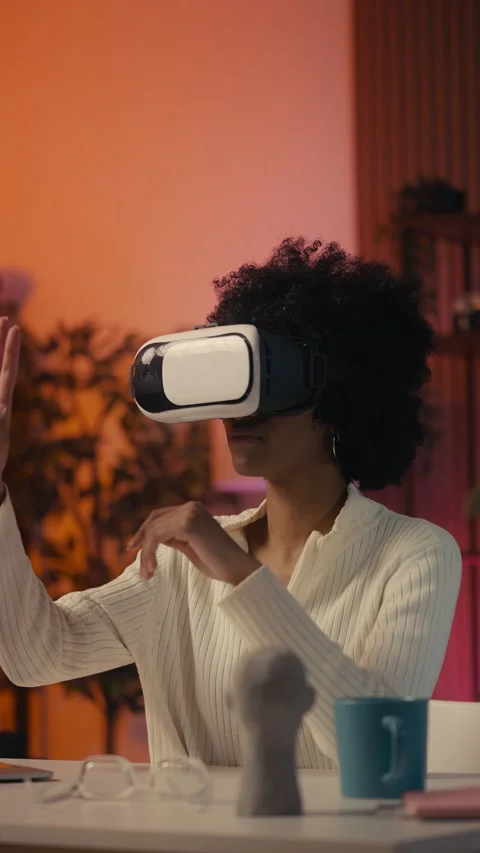 African American female developer testing new game in virtual reality headset Stock Footage 306285295