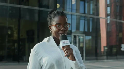 African American Female Journalist Making News Report in City Stock Footage 284698467