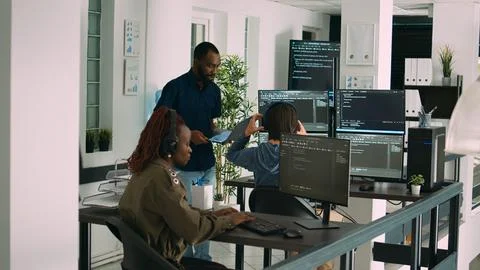 African american focused software engineer working on computer screen Stock Photos