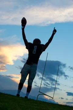 African American football player cheering in game Stock Photos