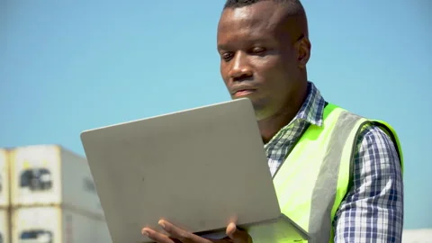 African american Foreman using laptop computer checking inventory control l.. Stock Footage 241717032