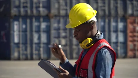 African american Foreman using tablet computer checking inventory control l.. Stock Footage 242308931