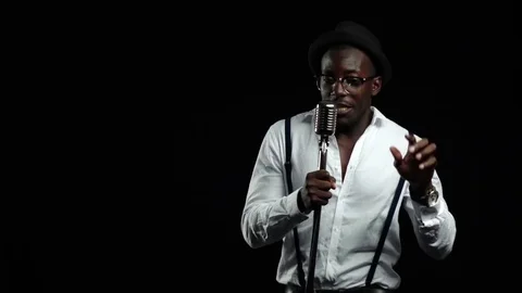 African American with glasses singing and dancing to the music from the Stock Footage