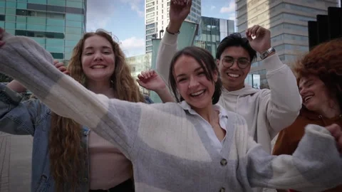 African American guy dance with her generation Z friends outdoors in the city Stock Footage 247408650