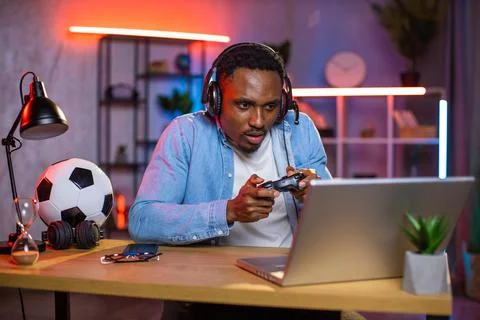 African american guy in headset, using joystick, sad when lost the video game 스톡 사진