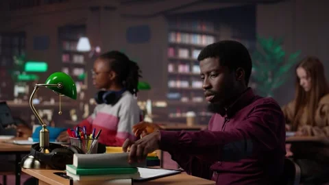 African american guy highlighting essential handwritten class notes Stock Footage 308723694