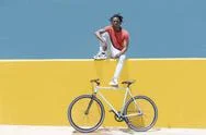 African American Guy Resting Near Bicycle Stock Photos