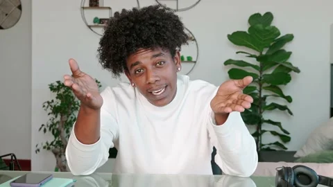African American guy talking to web camera recording web tutorial. 動画素材 231635909