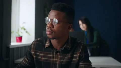 African american guy working with computer in office of software development Stock Footage 233723707