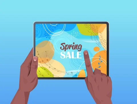 African american human hands using tablet pc with spring sale banner flyer or Stock Illustration