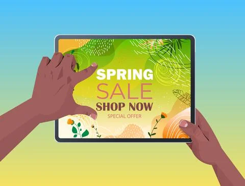 African american human hands using tablet pc with spring sale banner flyer or Illustrazione stock