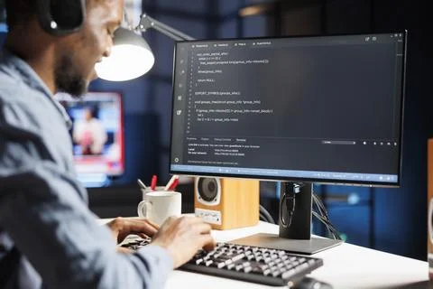 African american internet programmer writes server code Stock Photos