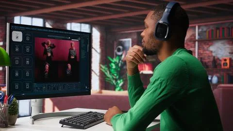 African American IT expert using AI technology to generate realistic images Stock Photos
