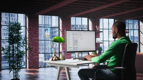 African American IT expert working with a computer full of code Stock Footage 307799563