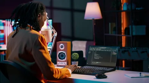 African american IT student practicing coding or programming exercises Stock Footage 265336426
