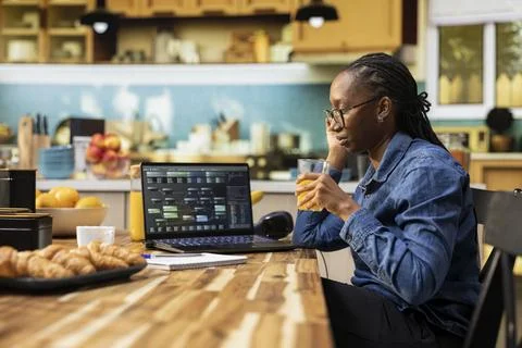 African american IT technician coding on laptop and programming scripts 스톡 사진