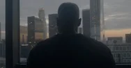 African American Looks Over Downtown Los Angeles Apartment At Twilight 4K Stock Footage
