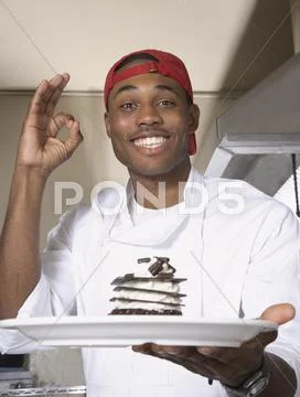 African American Male Chef Holding Desert